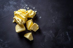 Chunks of Butter on Dark Surface