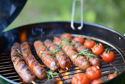 Grilled Sausages and Tomatoes on Barbecue