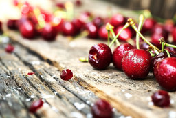 Fresh Cherries on Rustic Wooden Surface
