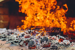 Intense Flames Engulfing Burnt Wood