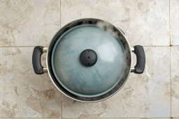 Cooking Pot with Lid on Tiled Floor