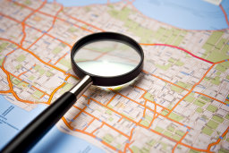 Magnifying Glass Over City Map