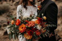Couple Embracing with Wedding Bouquet