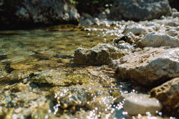 Stream Water Flowing Over Rocks