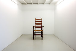 "Single Chair in a White Room"