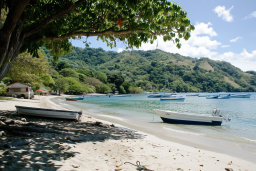 Tropical Beach with Boats and Green Hills